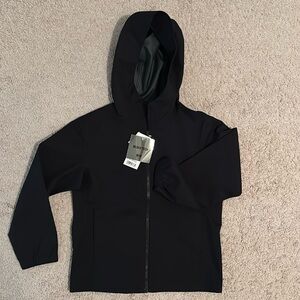 Never worn Kids raincoat size 7-8.